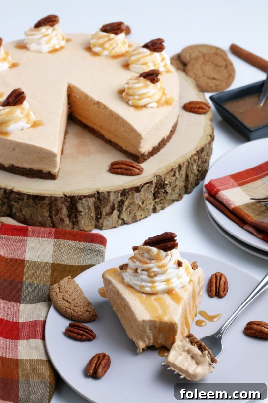 Smooth and creamy No Bake Pumpkin Cheesecake with extra spiced flavor and gingersnap crust. It is a fool proof recipe because it turns out amazing every time! This is the perfect Thanksgiving or Christmas dessert!