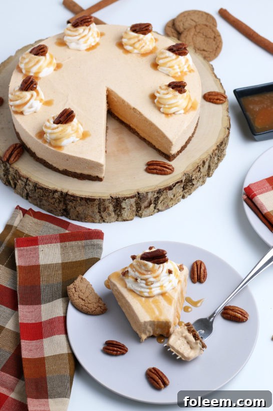 Smooth and creamy No Bake Pumpkin Cheesecake with extra spiced flavor and gingersnap crust. It is a fool proof recipe because it turns out amazing every time! What a perfect Thanksgiving or Christmas dessert!