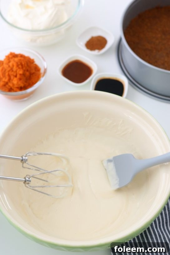Mixing the pumpkin filling for the No Bake Pumpkin Cheesecake recipe