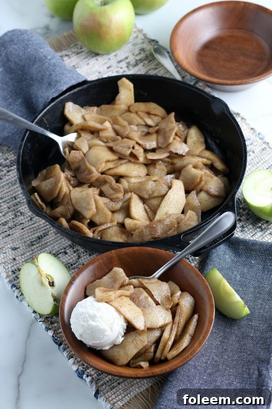 Perfectly cooked easy fried apples, golden brown and soft, served in a bowl. A comforting side dish or dessert.