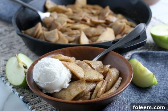 A wider shot showing a serving of easy fried apples in a decorative bowl, ready for a cozy meal.