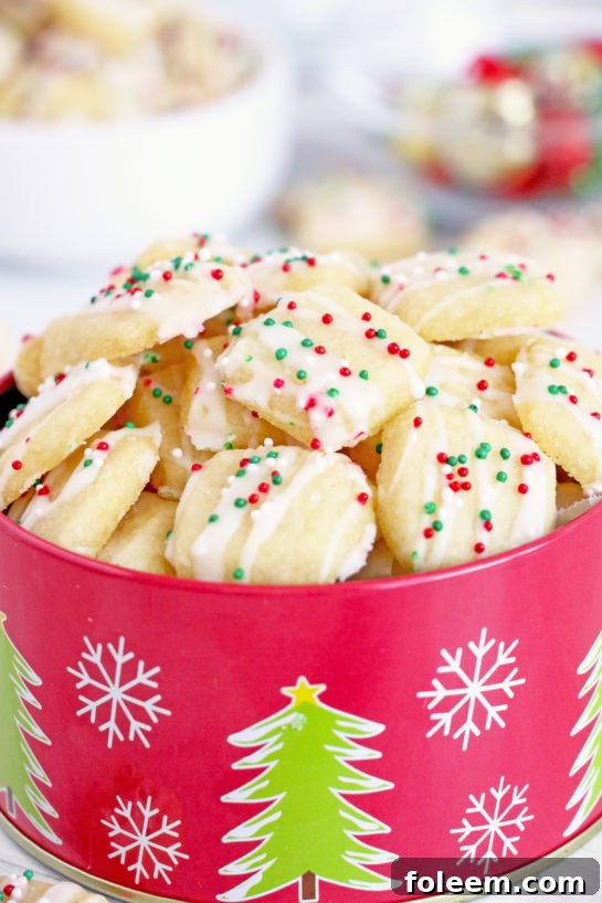 A festive tray of finished frosted Christmas Sugar Cookie Bites, ready for sharing.
