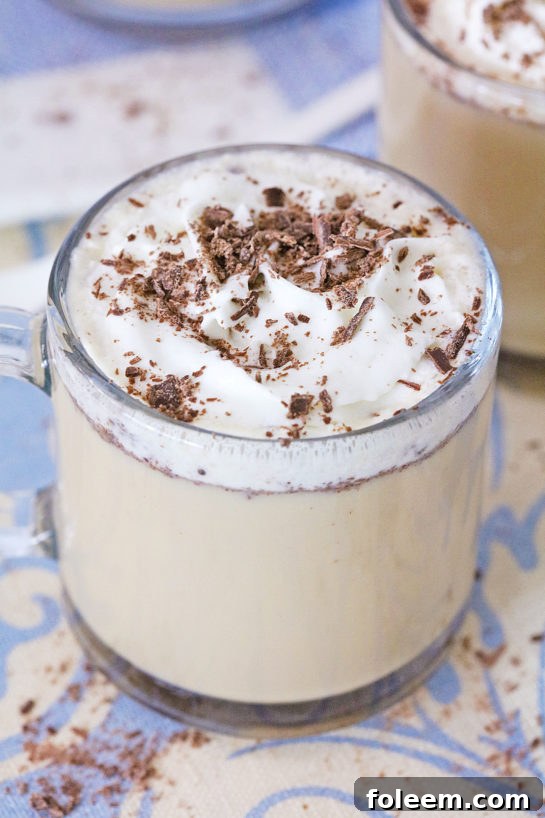 Coffee punch served in a mug, showcasing its frothy texture.
