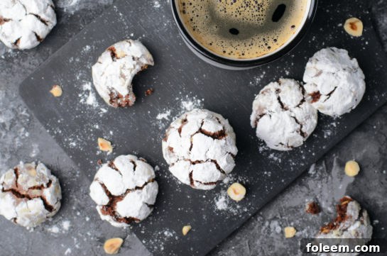 Stack of traditional chocolate hazelnut crinkle cookies, perfect for any holiday