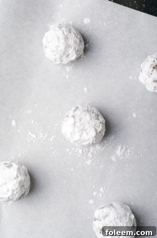 Baked chocolate hazelnut crinkle cookies cooling on a rack