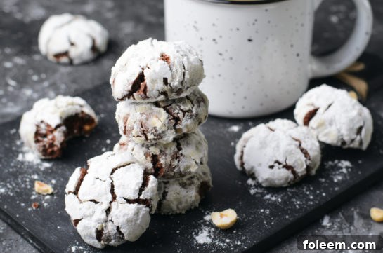 Close-up of baked chocolate hazelnut crinkle cookies, showcasing their chewy texture