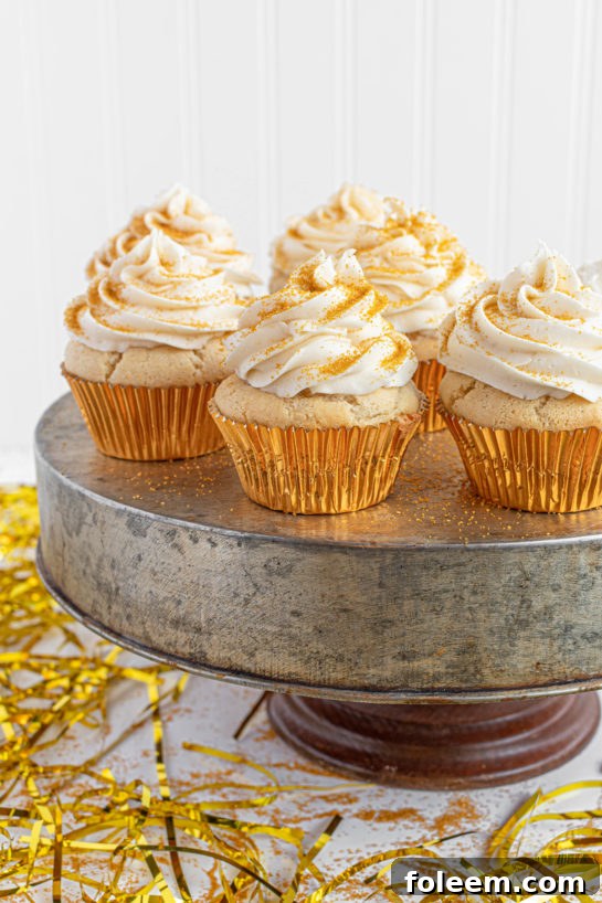 Celebration Champagne Cupcakes recipe adorned with gold sprinkles, perfect for birthdays, Mother's Day brunch, or a dazzling New Year’s Eve dessert.