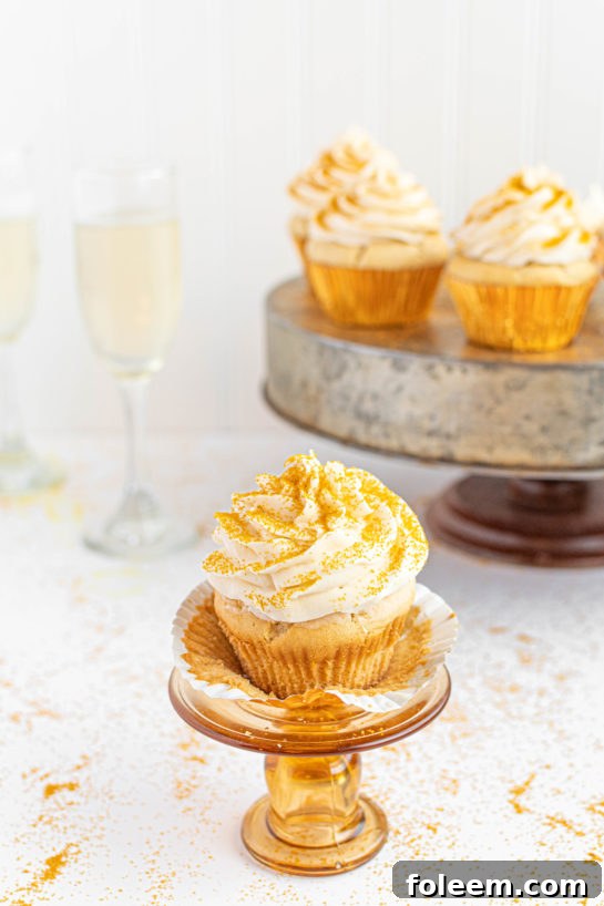 A completed display of beautiful Champagne Cupcakes, perfectly frosted and sprinkled, ready to brighten any celebration.