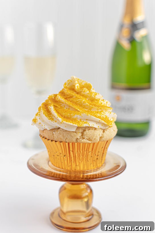 New Year's Eve Champagne Cupcakes featuring elegant gold sprinkles, ideal for any festive gathering, from birthdays to Mother's Day.