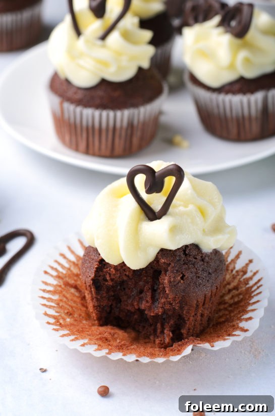 Close-up of a perfectly frosted Lover's Chocolate Cupcake, ready for a special occasion.