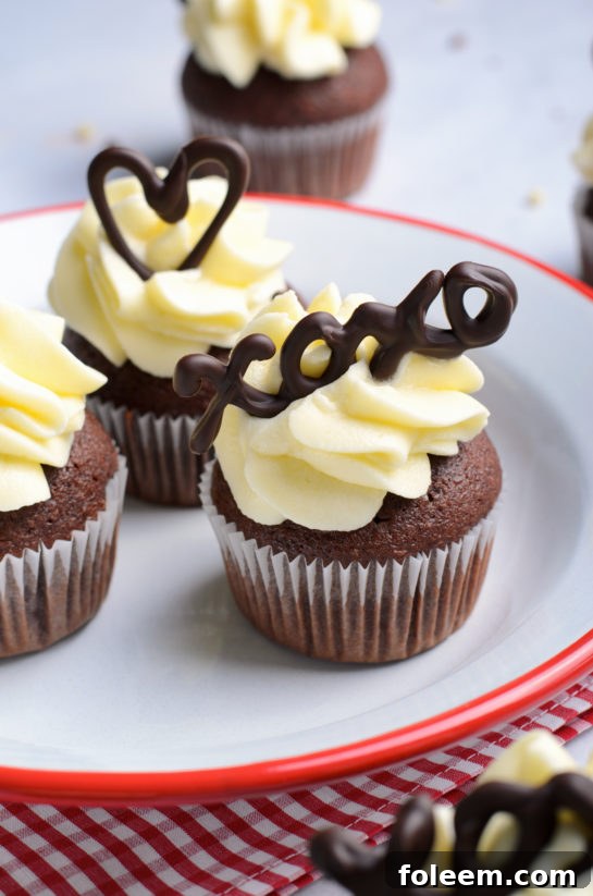 Close-up of a complete Valentine's Day Lover's Chocolate Cupcake, showcasing its rich frosting and topping.