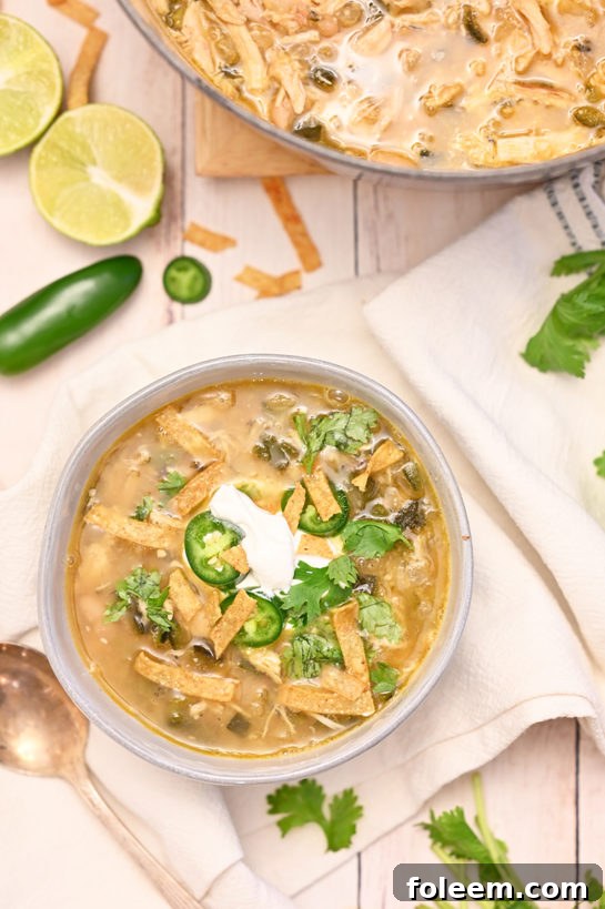 Delicious White Chicken Chili recipe, served in a rustic bowl, showcasing tender chicken, creamy white beans, and fresh herbs, perfect for a cozy meal.