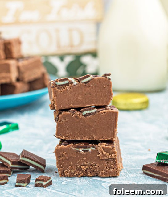 Close-up shot of stacked pieces of Andes Mint Fudge, ready to eat.
