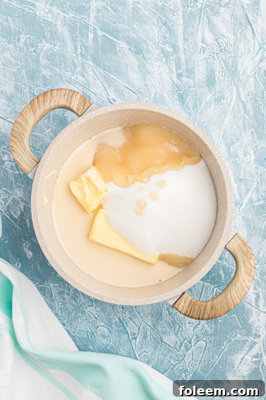 Mixing butter and sugar in a saucepan for the fudge base.