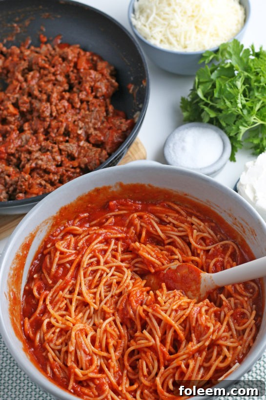 A delightful mix of cheeses and cream cheese forms the luscious, creamy layer that defines this Million Dollar Spaghetti.
