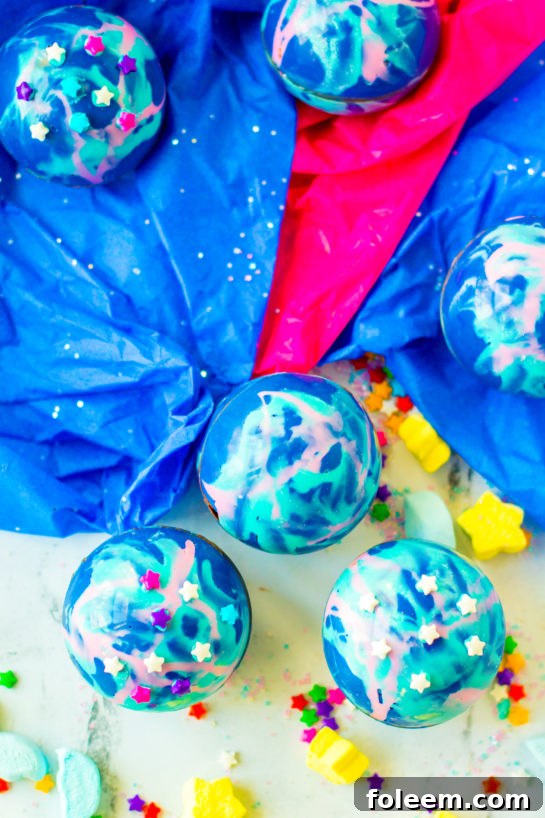 A collection of vibrant Galaxy Hot Chocolate Bombs.