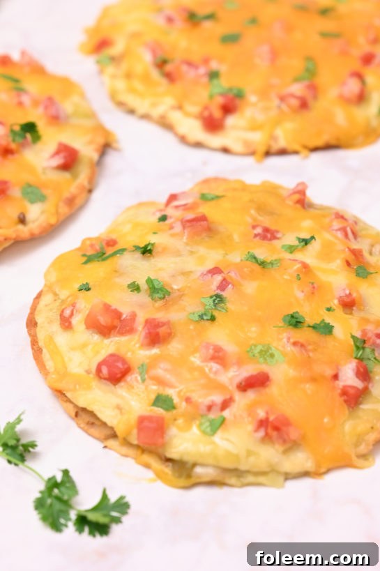 Overhead shot of the Mexican Pizza recipe is a quick and easy dinner idea for Mexican night, taco Tuesday, or Cinco de Mayo! The whole family will love these!