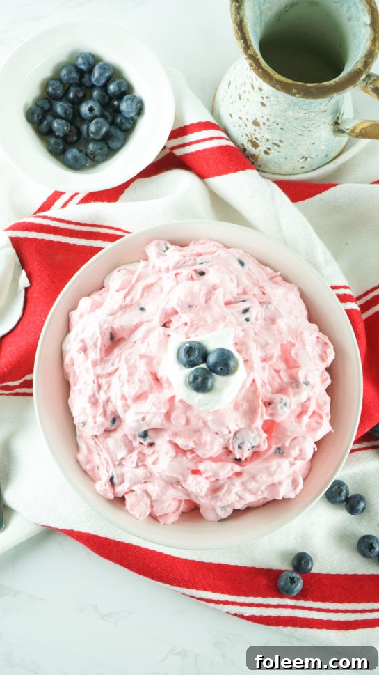 Overhead shot of the full bowl of Patriotic Red White and Blue Fluff Salad, inviting and vibrant.