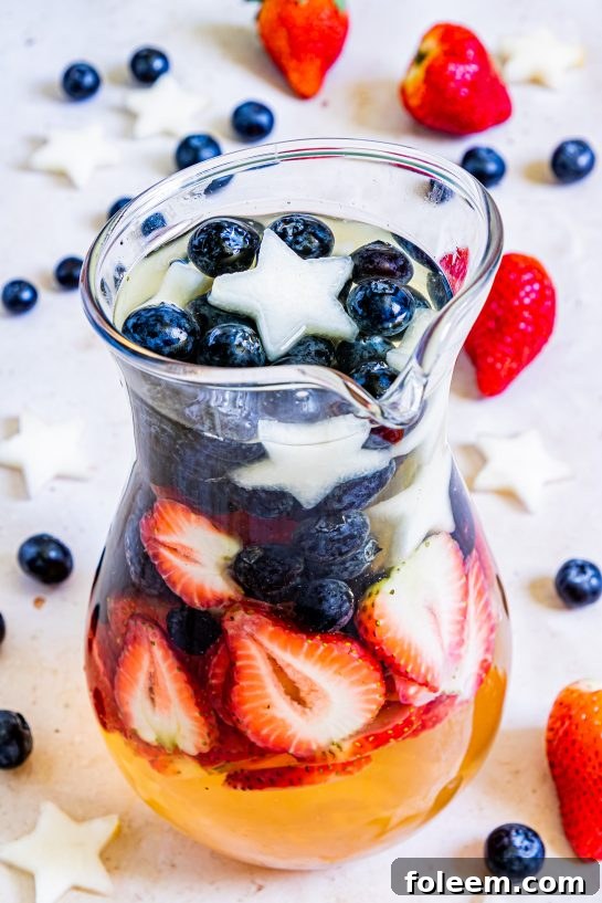 Photo of the pitcher of Patriotic Sangria recipe ready to serve for the fourth of July
