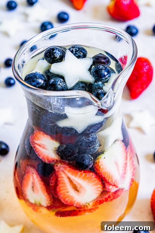 Drink on my Patriotic Sangria recipe this summer to enjoy a cocktail while beating the heat at the same time! With fresh blueberries, strawberries, white grape juice, brandy, and wine, it's perfect for 4th of July or Memorial Day!