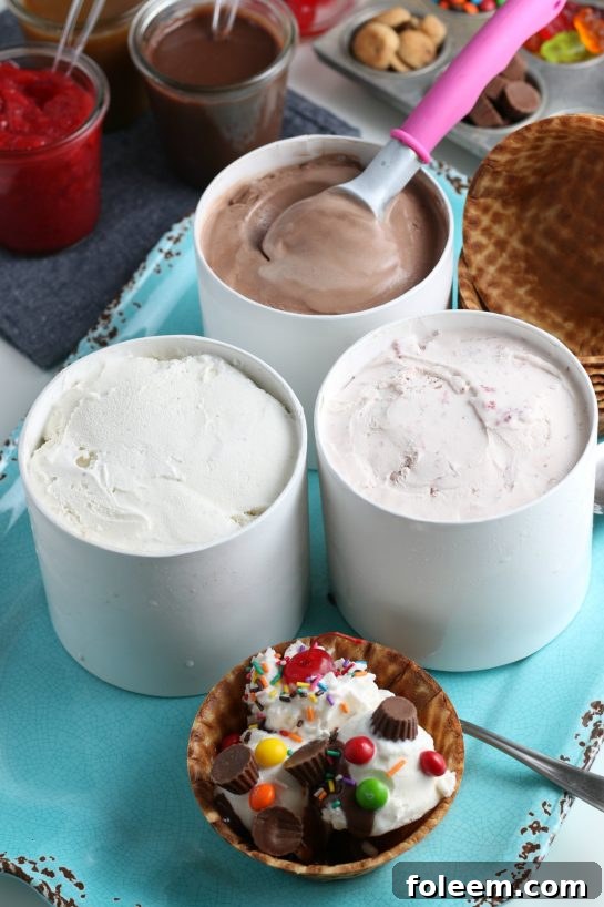 A close-up view of various vibrant ice cream sundae toppings like candies, sauces, and fruits.