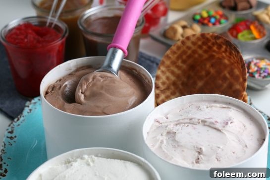 A wide shot of a lavish ice cream sundae bar with a focus on the variety of toppings and colorful display.