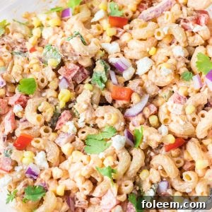 Close-up photo of Mexican Street Corn Pasta Salad is light and healthy, yet so delicious. It’s the perfect side or main dish for a big gathering or just a quick meal during the week with a Mexican twist!