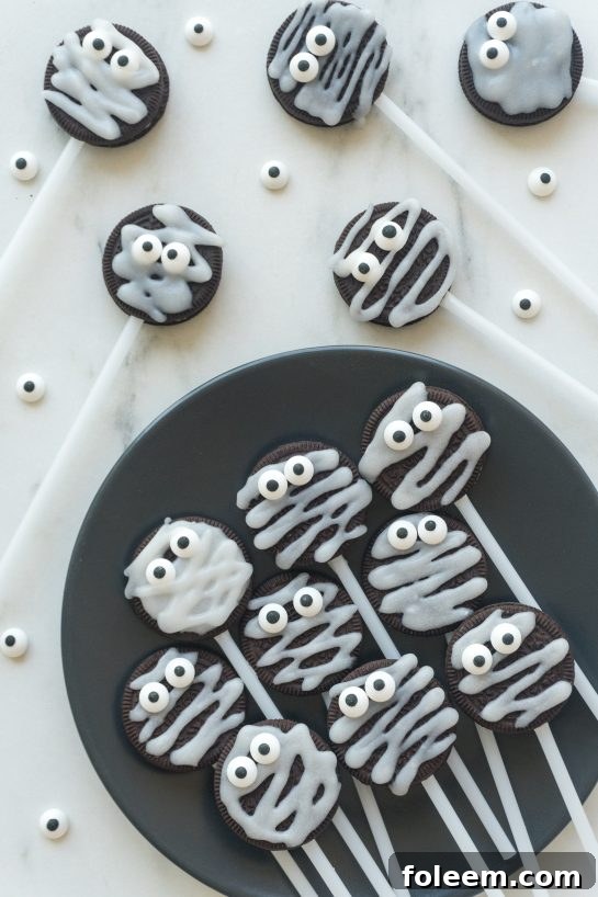 Overhead shot of freshly decorated Halloween Mummy Oreo Pops.