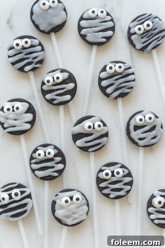 Overhead view of Halloween Mummy Oreo Pops, perfect for a party or trick-or-treating.