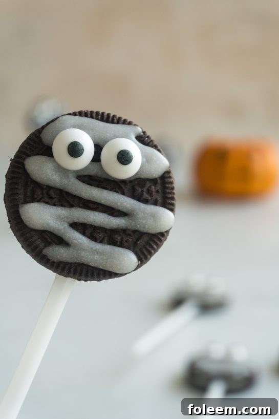 Close-up of a Mummy Oreo Pop, showing the detail of the glaze bandages.
