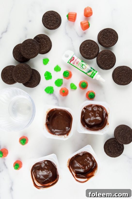 All the ingredients laid out to make pumpkin patch dirt cups for an easy fall dessert