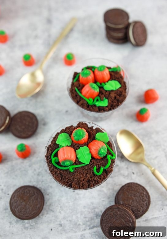 Overhead shot of the Pumpkin Patch Dirt Cups, highlighting the perfect layering and festive pumpkin candies