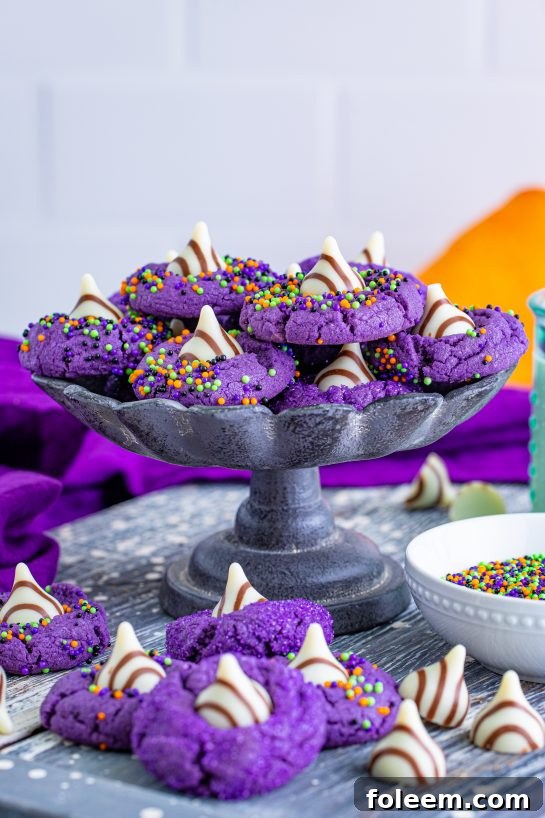 Simple and spooky purple Halloween Witch Hat Cookies, ideal for fall and Halloween parties.