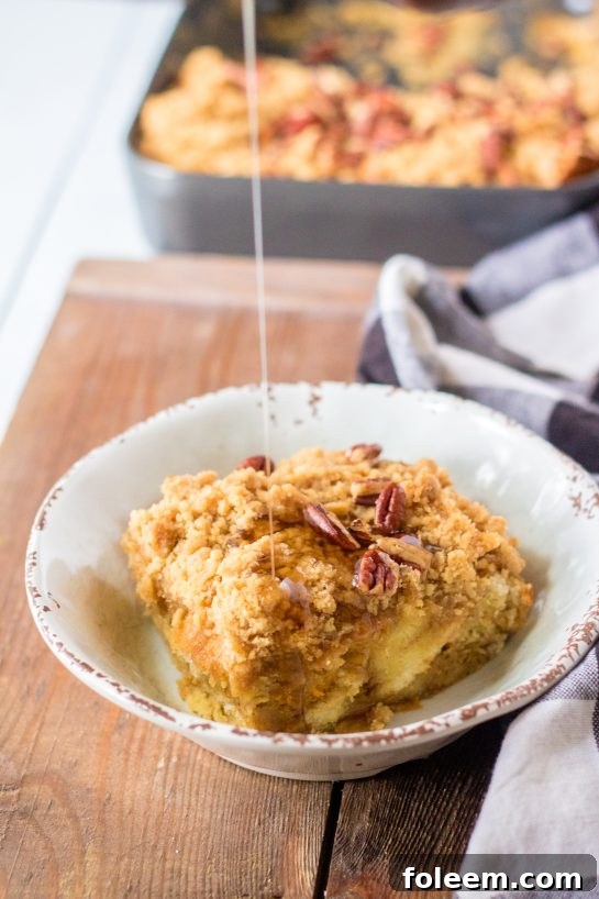An inviting overhead shot of the Sweet Potato French Toast Casserole, freshly baked and golden brown, featuring a delightful crumbly topping.