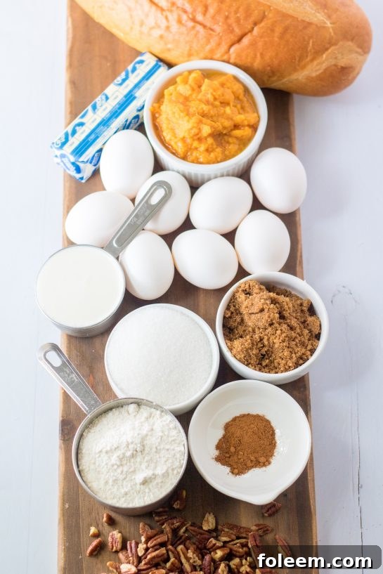 All the essential ingredients neatly laid out on a kitchen counter for preparing the Sweet Potato French Toast Casserole, including bread, sweet potatoes, eggs, and spices.