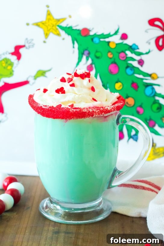 This Grinch Hot Chocolate recipe is the perfect combination of creamy, smooth hot chocolate and green Grinch fun for Christmas. Kids and adults will love it!