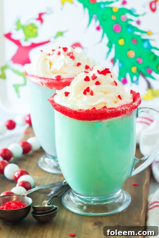 Festive green Grinch Hot Chocolate recipe is the perfect combination of creamy, smooth hot chocolate and green Grinch fun for Christmas. Kids and adults will love it!