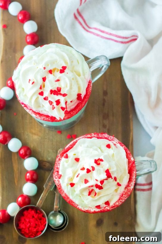 Overheard shot of the Grinch Hot Chocolate recipe that is the perfect combination of creamy, smooth hot chocolate and green Grinch fun for Christmas. Kids and adults will love it!