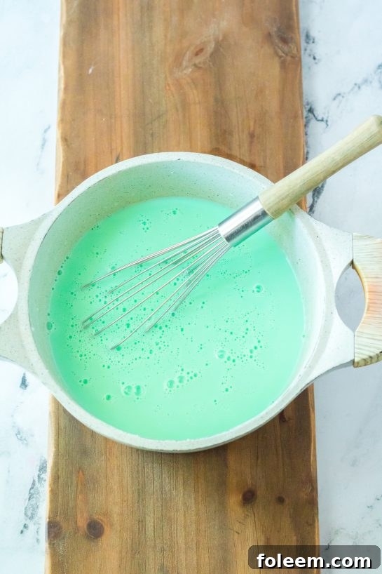 Melting the chocolate needed to make the Grinch Hot Chocolate recipe for Christmas holiday