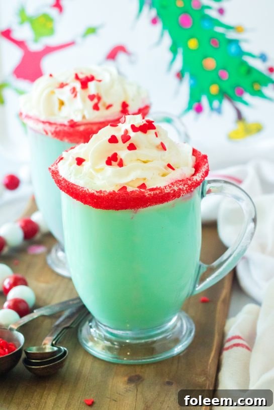 This Grinch Hot Chocolate recipe is the perfect combination of creamy, smooth hot chocolate and green Grinch fun for Christmas. Kids and adults alike will love it!