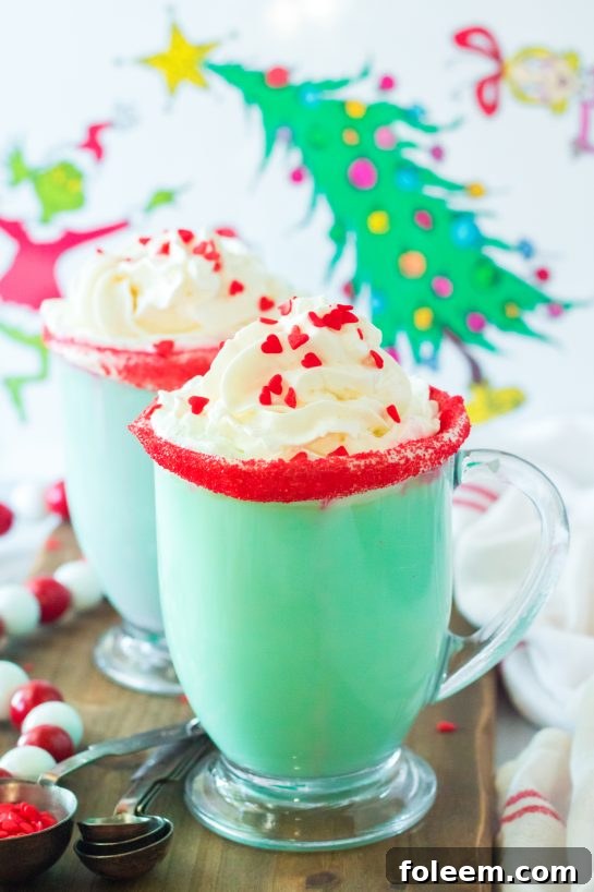 Green Grinch Hot Chocolate recipe is the perfect combination of creamy, smooth hot chocolate and green Grinch fun for Christmas. Kids and adults alike will love it!