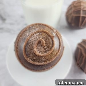 A close-up of a finished Mocha Hot Chocolate Bomb, ready to be melted into a warm drink.