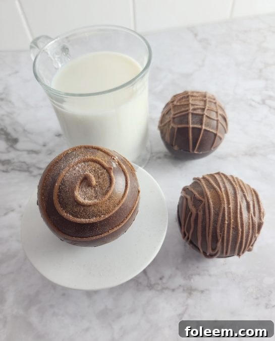 Finished Mocha Hot Chocolate Bombs, beautifully decorated with a drizzle of white chocolate.
