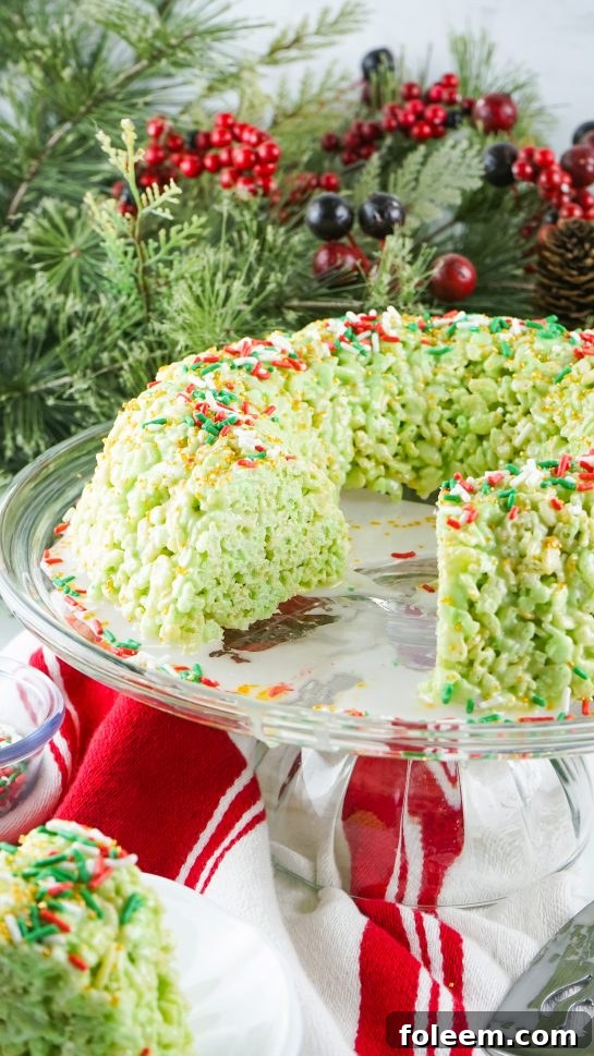 Slicing the festive Rice Krispies Treats Wreath Cake for serving