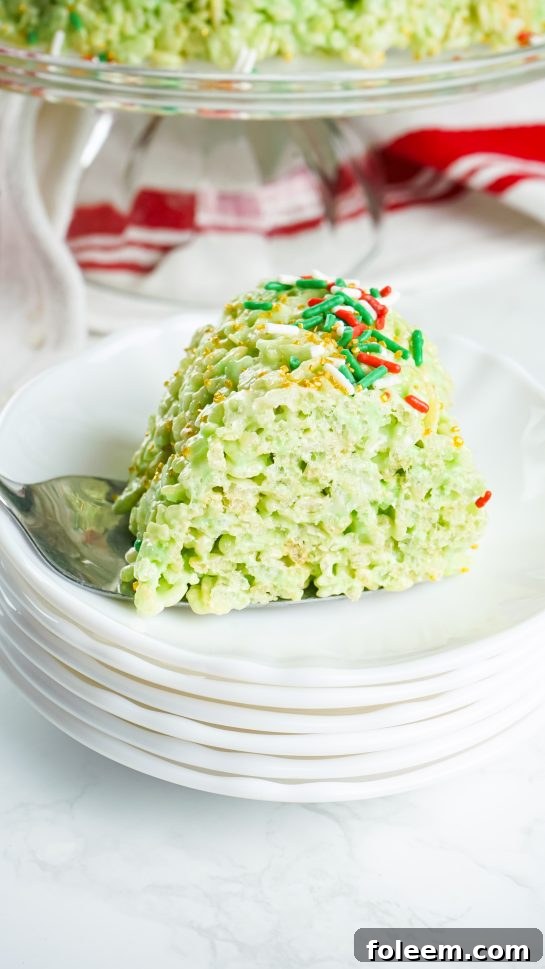 Plating a slice of Rice Krispies Treats Wreath Cake with a holiday theme