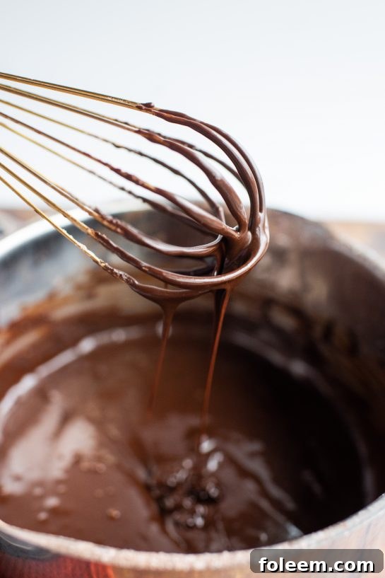 The chocolate ganache for the Peanut Butter Thumbprint Cookies recipe 