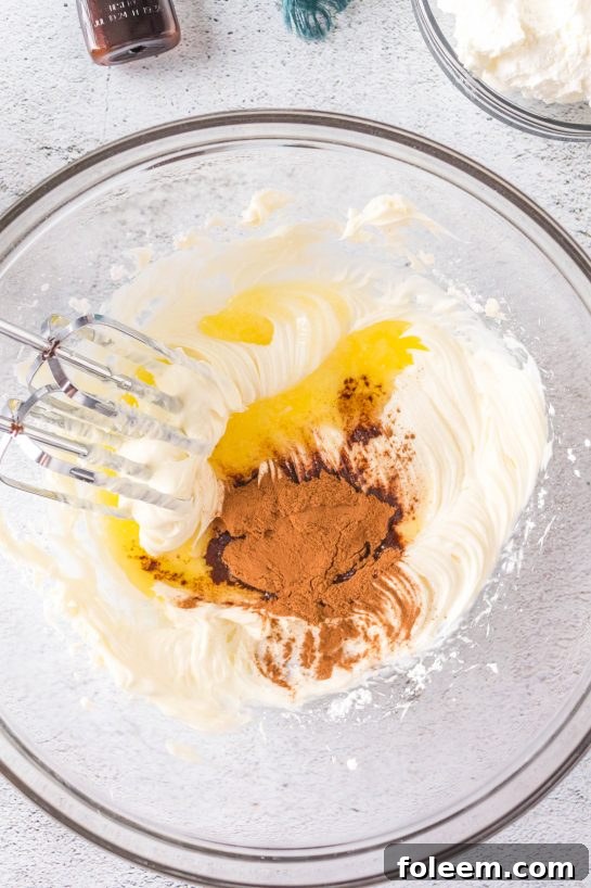 Ingredients being mixed to make this easy Cinnamon Roll Dip recipe