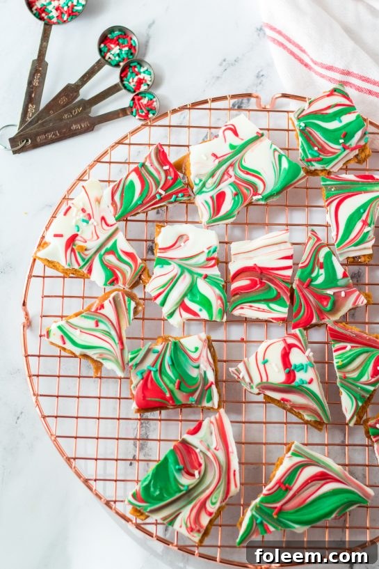 Delicious Christmas Ritz Cracker Toffee with chocolate and sprinkles, ready to be devoured.