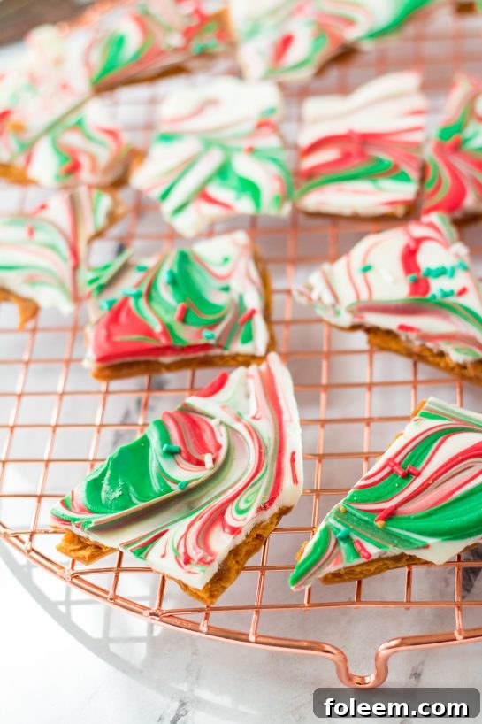Close-up detail of the smooth chocolate and vibrant sprinkles on Christmas Ritz Cracker Candy.