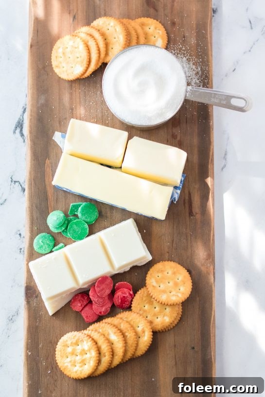 Array of simple ingredients for making Christmas Ritz Cracker Candy, including butter, sugar, crackers, and chocolate.